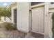 Close-up view of a secure front door with a decorative security screen and inviting welcome mat at 1717 E Union Hills Dr # 1110, Phoenix, AZ 85024