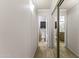 Hallway view with access to bathrooms and mirrored closet doors at 1717 E Union Hills Dr # 1110, Phoenix, AZ 85024