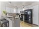 Modern kitchen featuring white cabinetry, a breakfast bar, and stainless steel appliances at 1717 E Union Hills Dr # 1110, Phoenix, AZ 85024