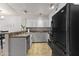 Well-maintained kitchen featuring white cabinetry, a breakfast bar, and tiled flooring at 1717 E Union Hills Dr # 1110, Phoenix, AZ 85024