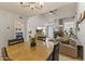Open-concept living space with a dining area, comfortable seating, and a cozy fireplace at 1717 E Union Hills Dr # 1110, Phoenix, AZ 85024