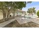 A serene view of a community pool featuring covered seating and lush landscaping at 1717 E Union Hills Dr # 1110, Phoenix, AZ 85024