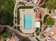 Overhead aerial view of a refreshing community pool with lounge chairs and well-maintained landscaping at 1717 E Union Hills Dr # 1110, Phoenix, AZ 85024