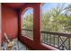 The balcony with a view offers a cozy seating area with a wicker chair and an outdoor rug at 1920 E Bell Rd # 1034, Phoenix, AZ 85022