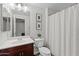 Well-lit bathroom featuring a single sink, decorative art, and a shower/tub combo at 1920 E Bell Rd # 1034, Phoenix, AZ 85022