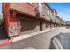 Row of townhome garages with brown doors and stone accents adding curb appeal at 1920 E Bell Rd # 1034, Phoenix, AZ 85022