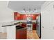 Well-equipped kitchen featuring stainless steel appliances, track lighting, and tile flooring at 1920 E Bell Rd # 1034, Phoenix, AZ 85022