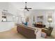 Spacious living room with neutral decor, comfortable seating, and an open layout connecting to the dining area at 1920 E Bell Rd # 1034, Phoenix, AZ 85022