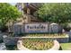 A beautifully landscaped community sign with flowers and stone accents adds to the neighborhood's charm at 1920 E Bell Rd # 1034, Phoenix, AZ 85022