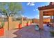 Paver-lined backyard with potted plants and desert landscaping at 2041 N 88Th St, Mesa, AZ 85207