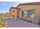 Well-kept backyard showcasing a brick-paved patio and a desert landscaped yard at 2041 N 88Th St, Mesa, AZ 85207