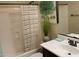 Bathroom with a shower-tub combo, vanity with sink, and a decorative plant at 2041 N 88Th St, Mesa, AZ 85207