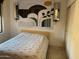 Comfortable bedroom with white patterned quilt and tile flooring at 2041 N 88Th St, Mesa, AZ 85207