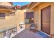 Welcoming courtyard featuring stylish outdoor furniture and a cozy welcome mat, all under the protection of a covered patio at 2041 N 88Th St, Mesa, AZ 85207