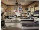 Well-equipped community fitness center with treadmills, elliptical, weights and a ceiling fan at 2041 N 88Th St, Mesa, AZ 85207