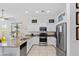 Well-equipped kitchen featuring stainless steel appliances, granite countertops, and ample cabinet space for modern living at 2041 N 88Th St, Mesa, AZ 85207