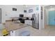 Contemporary kitchen with granite countertops, stainless steel appliances, and a large island with a breakfast bar at 2041 N 88Th St, Mesa, AZ 85207