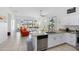Open-concept kitchen and living area featuring granite countertops, a stylish seating arrangement, and bright natural light at 2041 N 88Th St, Mesa, AZ 85207