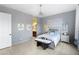 Comfortable bedroom with stylish gray walls, tiled floors, and a ceiling fan at 2041 N 88Th St, Mesa, AZ 85207