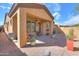 Cozy covered patio with ceiling fan and landscaped backyard, perfect for outdoor living and entertaining at 2041 N 88Th St, Mesa, AZ 85207