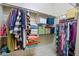Organized walk-in closet with clothing racks, shelving, and ample storage space at 2041 N 88Th St, Mesa, AZ 85207