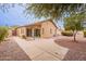 Spacious backyard features a covered patio and well-maintained desert landscaping at 20449 N 105Th Ave, Peoria, AZ 85382