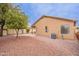 Backyard featuring desert landscaping with an AC unit, patio, and lawn at 20449 N 105Th Ave, Peoria, AZ 85382