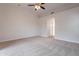 Spacious bedroom featuring plush carpet, recessed lighting, ceiling fan and bright white walls at 20449 N 105Th Ave, Peoria, AZ 85382
