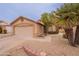 Charming single-story home featuring a two-car garage, neutral stucco and low-maintenance desert landscaping at 20449 N 105Th Ave, Peoria, AZ 85382