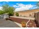Large backyard features a patio, privacy fence, storage shed and a stone mulch garden at 23006 W Cantilever St, Buckeye, AZ 85326