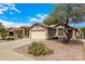 Single-story home with desert landscaping in the front yard at 23006 W Cantilever St, Buckeye, AZ 85326