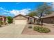 Charming single-story home with a two car garage and desert landscaping at 23006 W Cantilever St, Buckeye, AZ 85326