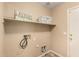 Laundry room features a shelf and the appliance connections at 23006 W Cantilever St, Buckeye, AZ 85326