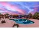 Beautiful backyard pool area featuring multiple pergolas, lush landscaping, and a relaxing atmosphere at 23040 W Hammond Ln, Buckeye, AZ 85326