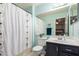 This bathroom features a toilet, sink with vanity, and shower with a curtain at 23040 W Hammond Ln, Buckeye, AZ 85326