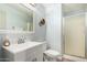 Bathroom features modern sink vanity, large mirror, toilet and glass door shower at 23040 W Hammond Ln, Buckeye, AZ 85326