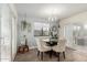 Breakfast nook with a glass table, seating for four, and sliding glass doors to the backyard at 23040 W Hammond Ln, Buckeye, AZ 85326