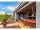 Comfortable covered patio with a hammock and ceiling fan at 23040 W Hammond Ln, Buckeye, AZ 85326