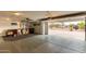 Spacious garage with an open door, offering abundant space for parking and storage at 23040 W Hammond Ln, Buckeye, AZ 85326