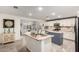 Spacious kitchen with a center island, granite countertops, stainless appliances and an open layout at 23040 W Hammond Ln, Buckeye, AZ 85326