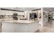 Beautiful open kitchen with white cabinets, stainless steel appliances, and granite countertops at 23040 W Hammond Ln, Buckeye, AZ 85326