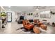 Bright living room with hardwood floors, leather furniture, and a modern open-concept design at 23040 W Hammond Ln, Buckeye, AZ 85326