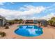 Backyard view of the pool with surrounding patio, pergolas, and landscaping at 23040 W Hammond Ln, Buckeye, AZ 85326