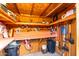 A well-organized storage shed with shelves, tools, and a workbench, perfect for DIY projects at 23040 W Hammond Ln, Buckeye, AZ 85326