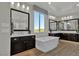 Bright bathroom with dual vanities, soaking tub, and large mirrors offers space and style at 2541 E Presidio St, Mesa, AZ 85213