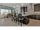 Modern kitchen featuring a large island, pendant lights and stainless steel appliances at 2541 E Presidio St, Mesa, AZ 85213
