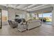 Light-filled living room featuring hardwood floors, coffered ceiling and large windows at 2541 E Presidio St, Mesa, AZ 85213