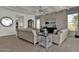 Open living room features hardwood floors, neutral paint, ceiling fan, and coffered ceiling at 2541 E Presidio St, Mesa, AZ 85213