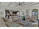 Inviting living room showcasing hardwood floors, a ceiling fan and an open layout at 2541 E Presidio St, Mesa, AZ 85213