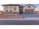 Beautiful single-story home with a brick-accented facade, paver driveway, and a welcoming entrance at 2636 E Virginia St, Mesa, AZ 85213